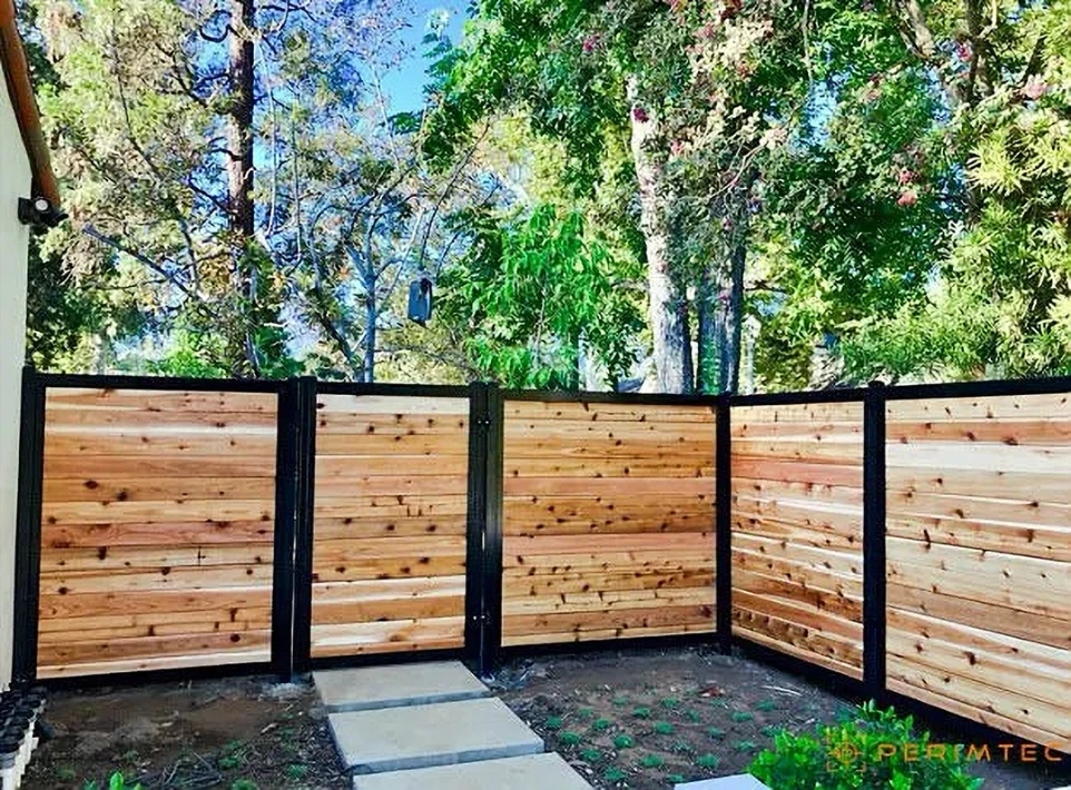 Horizontal wood slats in a steel framed fence